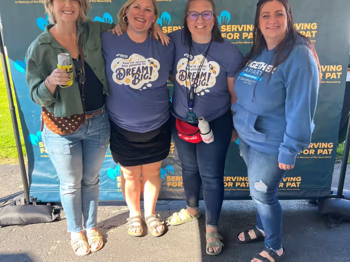 Simplicity staff volunteering at a community event