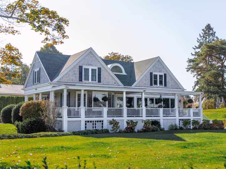 A white house with a wide front porch
